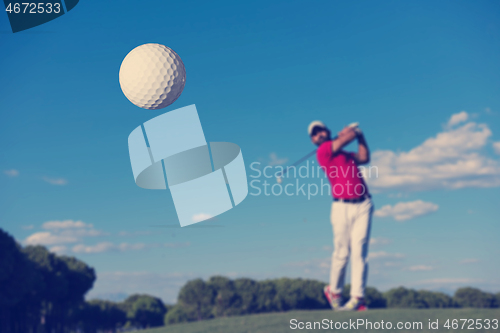 Image of golf player hitting long shot