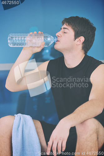 Image of man drink water at fitness workout