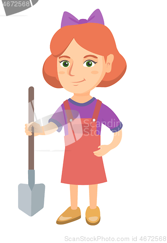 Image of Caucasian smiling girl holding a shovel.