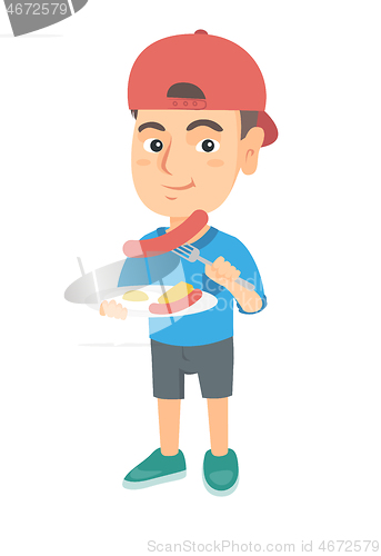 Image of Boy eating sausage and fried egg for breakfast.