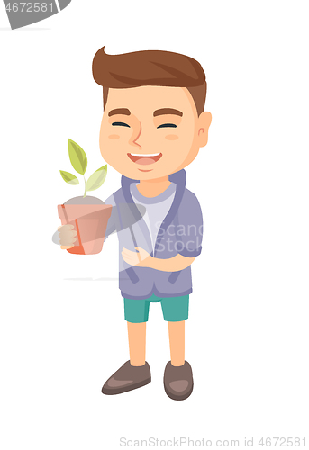 Image of Caucasian smiling boy holding a potted plant.