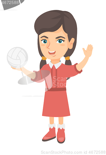 Image of Little caucasian girl holding a volleyball ball.