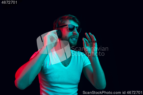 Image of Enjoying his favorite music.