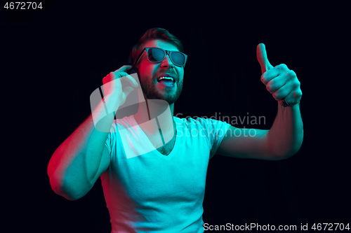 Image of Enjoying his favorite music.