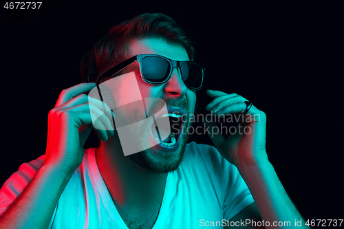 Image of Enjoying his favorite music.