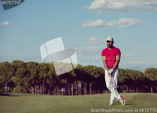 Image of handsome middle eastern golf player portrait at course