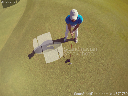 Image of top view of golf player hitting shot