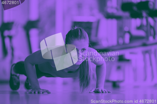 Image of warming up and doing some push ups a the gym