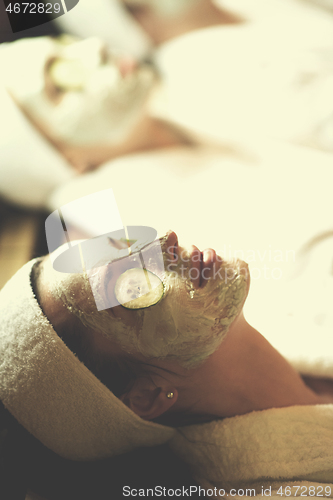 Image of woman in spa  with cosmetic mask