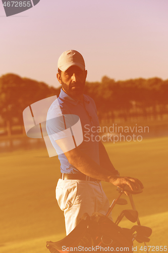 Image of golfer  portrait at golf course