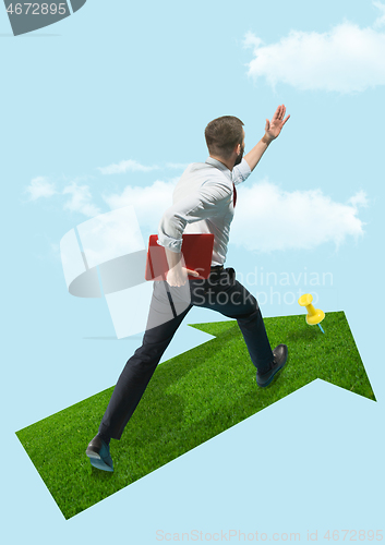 Image of Businessman holding laptop walking on graphic stair, start up business concepts.