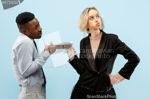 Image of Serious businesswoman and colleague in the office.