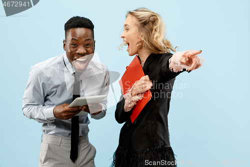 Image of Concept of partnership in business. Young man and woman standing at studio
