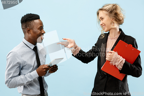 Image of Concept of partnership in business. Young man and woman standing at studio