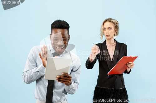 Image of Serious businesswoman and colleague in the office.