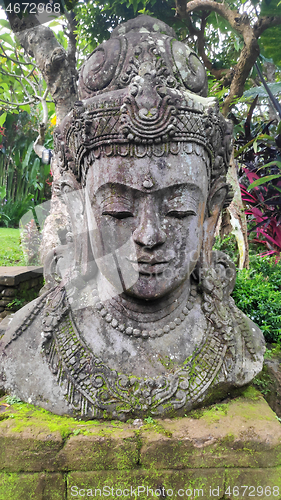 Image of Buddha image in the tropical garden in Bali 