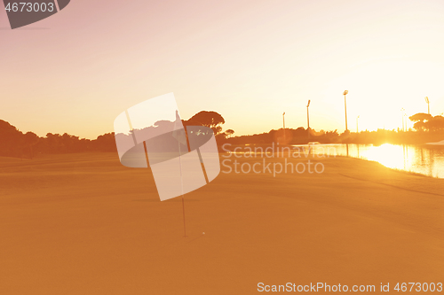 Image of golf ball on edge of  the hole