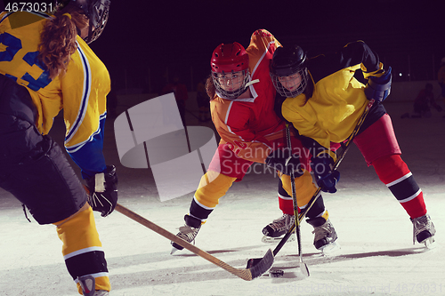 Image of teen ice hockey sport  players in action