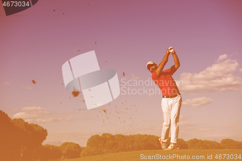 Image of golf player hitting long shot