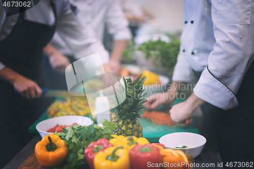 Image of team cooks and chefs preparing meals