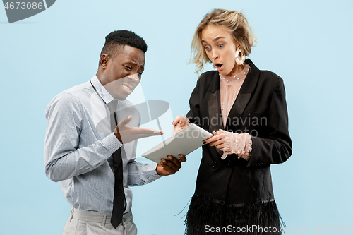 Image of Serious businesswoman and colleague in the office.