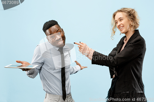 Image of Concept of partnership in business. Young man and woman standing at studio