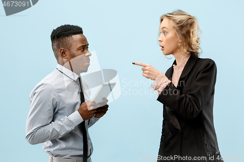 Image of Serious businesswoman and colleague in the office.