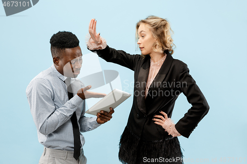 Image of Serious businesswoman and colleague in the office.