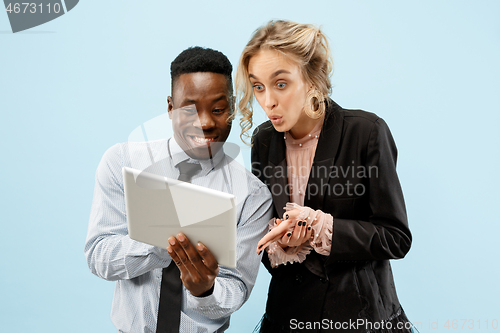 Image of Concept of partnership in business. Young man and woman standing at studio