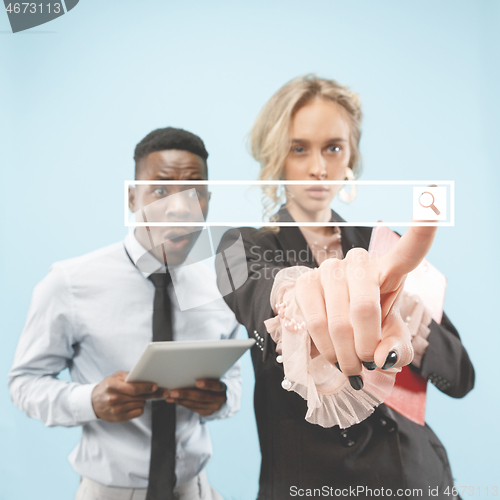 Image of Woman\'s hand with finger on blue background