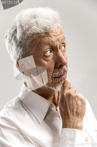 Image of serious thoughtful businessman. Doubt concept.