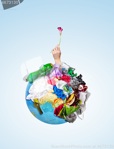 Image of A globe of the earth with trash over white background, the concept of ecology problem