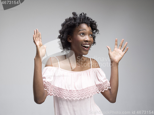 Image of Winning success woman happy ecstatic celebrating being a winner. Dynamic energetic image of female afro model