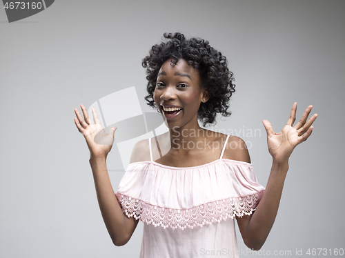 Image of Winning success woman happy ecstatic celebrating being a winner. Dynamic energetic image of female afro model