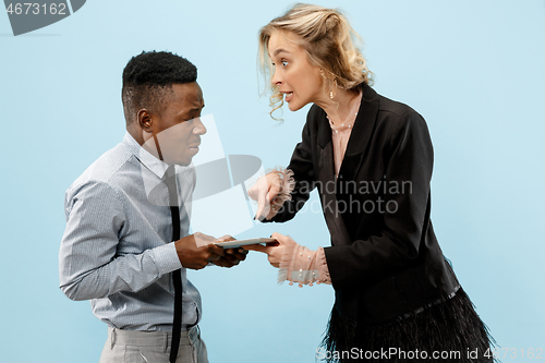 Image of Serious businesswoman and colleague in the office.