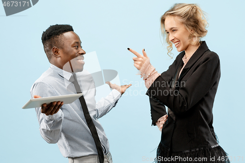 Image of Concept of partnership in business. Young man and woman standing at studio