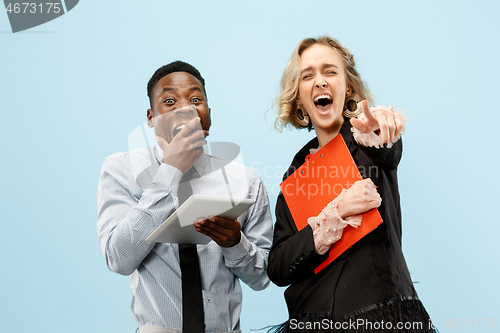 Image of Concept of partnership in business. Young man and woman standing at studio