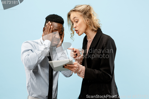 Image of Serious businesswoman and colleague in the office.