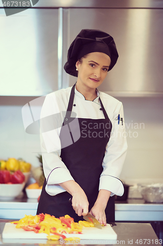 Image of Chef cutting fresh and delicious vegetables