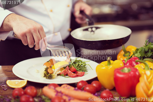 Image of chef serving vegetable salad