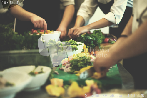 Image of team cooks and chefs preparing meals