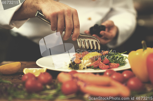 Image of chef serving vegetable salad