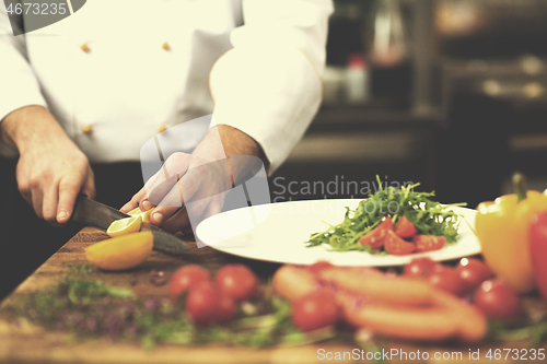 Image of chef serving vegetable salad