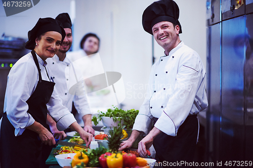 Image of team cooks and chefs preparing meals