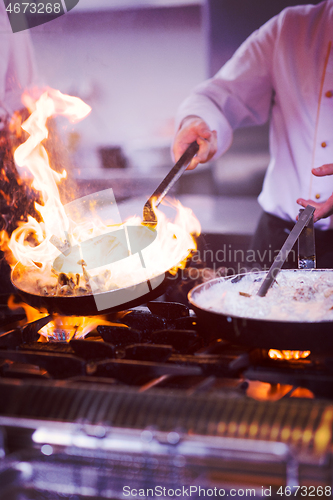 Image of Chef doing flambe on food