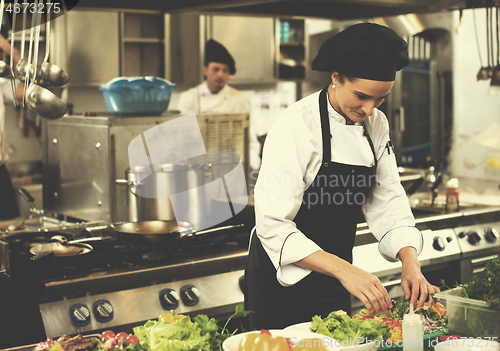 Image of chef serving vegetable salad