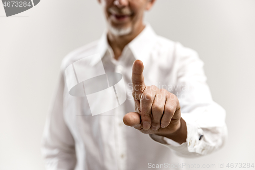 Image of Businessman hand touching empty virtual screen