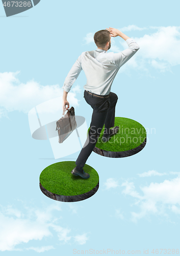 Image of Businessman holding briefcase walking on graphic stair, start up business concepts.