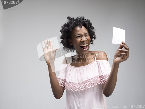 Image of Young woman with a surprised expression won a bet