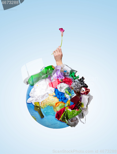 Image of A globe of the earth with trash over white background, the concept of ecology problem